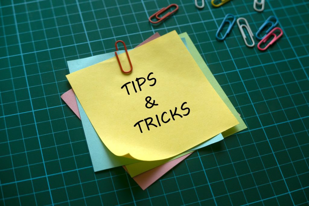 tips and tricks written on post it notes on lined table